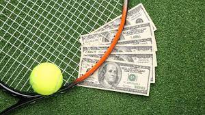 Image d'une raquette de tennis et de billets 